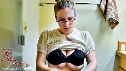 Xev Bellringer's huge breasts spilling from black bra in sheer blouse