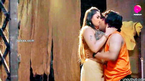 Indian MILF passionately kissing muscular man in saree embrace