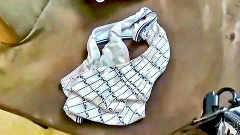 Stepmom's striped white panties discarded on bed after intense fuck session