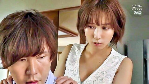 Cute Japanese brunette in low-cut lace top showing cleavage kissed by boyfriend in kitchen