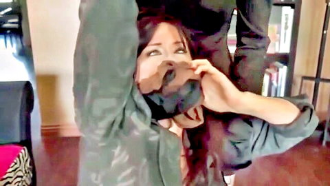 Brunette in green leather jacket kneels with mouth wide open for thick brown cock in domination scene