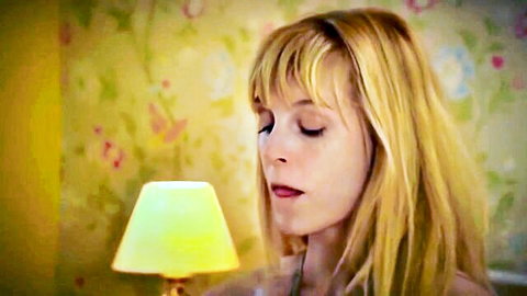 Ariel Anderssen blonde with bangs, eyes closed in serene pose