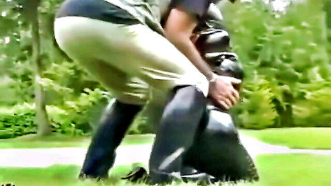 Leather-clad dominant spanking exposed ass in outdoor BDSM old/young scene
