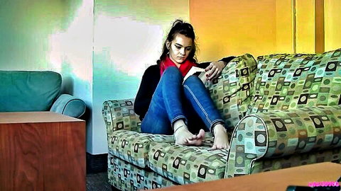 Young brunette reading book, rubbing bare feet solo foot fetish scene