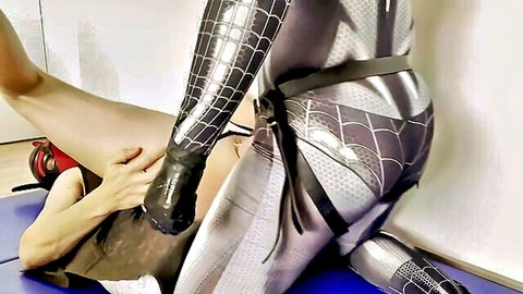 Queen G in Spider-Man suit dominates with pegging and fisting in BDSM scene