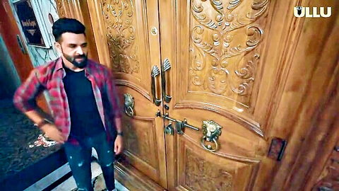 Bearded Indian man in plaid shirt and jeans at wooden door, Ullu adult series thumbnail