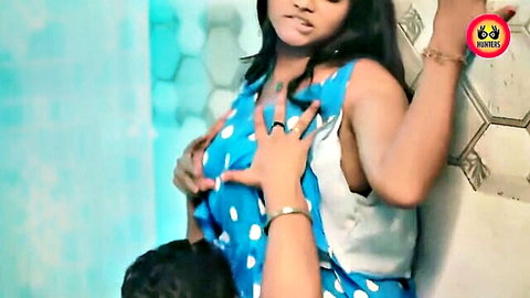 Indian couple foreplay: man gropes woman's big tits over blue polka-dot dress