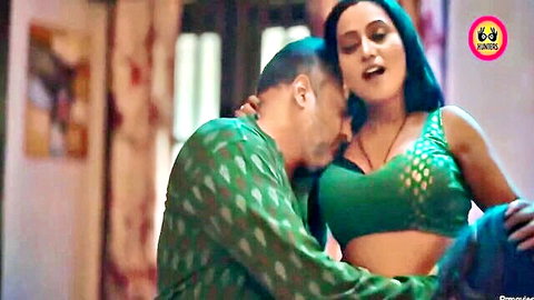 Desi woman with blue hair in green top passionately kissed by man in ethnic attire