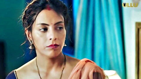 Seductive Indian wife in red saree with sindoor and mangalsutra showing cleavage