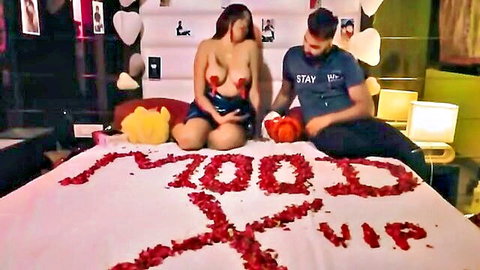 Indian MILF topless in red pasties for Valentine's Day with boyfriend on petal bed