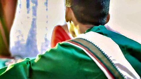 Indian couple in traditional green dhoti and red saree teasing wedding night fuck