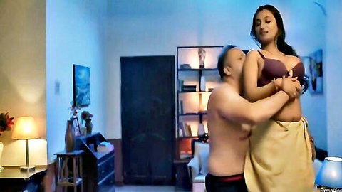 Indian MILF with big tits in purple bra hugged from behind by topless stud in red dhoti