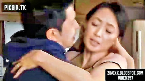 Japanese mom and son intimate embrace kiss in kitchen scene