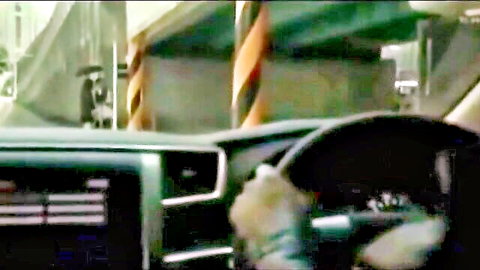 Bound hands gripping steering wheel in Asian BDSM car scene