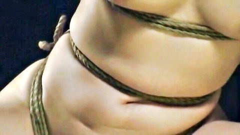 Close-up of bound Japanese woman in erotic rope fetish, JAV bondage