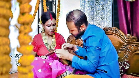 Indian MILF bride in red saree receives wedding ring from bearded groom