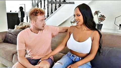 August Skye in white tank top teases with redhead guy on couch