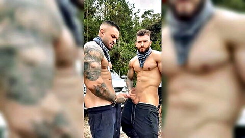 Two muscular tattooed bearded hunks in headscarves teasing bulges in sweatpants outdoors