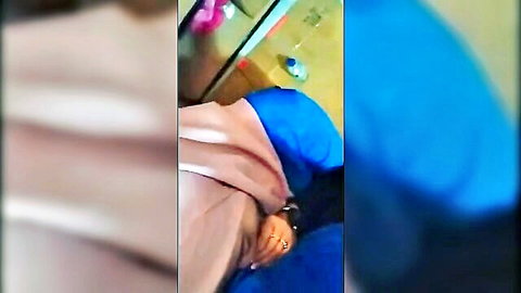 Blurry brunette Malaysian babe teasing with hand on blue sleeve in bedroom