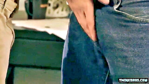 Gay twink slides hand into buddy's jeans groping hard cock bulge
