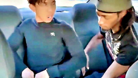 Young Asian guy wide-mouthed as black man touches him in car gay thumbnail
