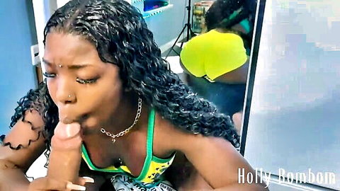 Ebony babe Holly Rainbeau giving blowjob to Allandelon in bikini