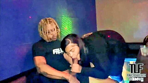 BBW Suzy bent over in black dress at karaoke bar, muscular guy behind her
