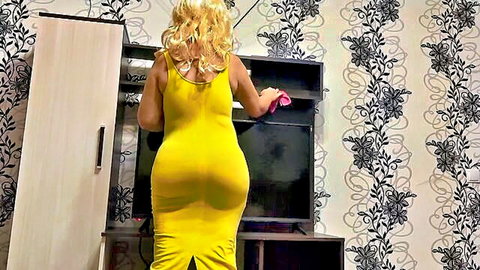 Blonde MILF in tight yellow dress bends over showing massive big ass while cleaning TV