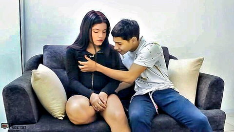 Young Latina couple in intimate clothed embrace, stepmom discovery moment