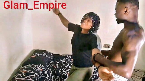 Muscular shirtless black stud grabs sexy braided black babe on bed teasing foreplay