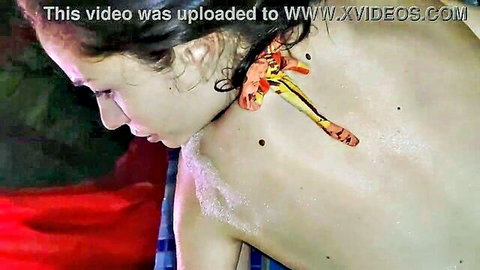 Nude brunette woman side profile, colorful shoulder design, hotel vibe