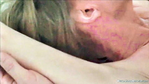 Close-up of mature blonde granny's neck with red marks in swinger threesome