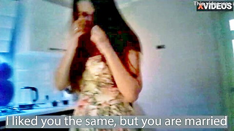 Brunette in floral dress confessing affair to married man on phone