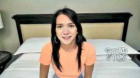 Cute brunette teen smiling in tight orange top on bed for exploited teens amateur casting