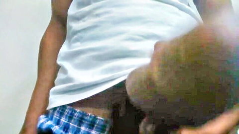 Muscular ebony guy pulls down plaid boxers spreading big black ass cheeks
