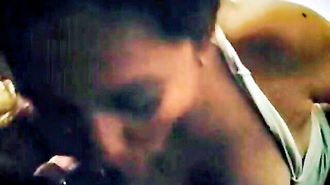 Blurry close-up of mature woman's sweaty face with yellow cum dripping from mouth after blowjob