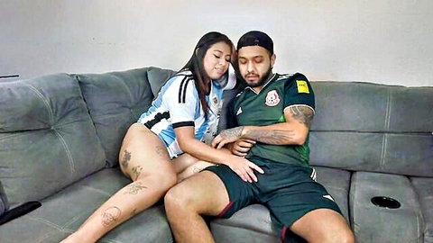 Latina couple in Mexico vs Argentina soccer jerseys cuddling intimately, big ass tease