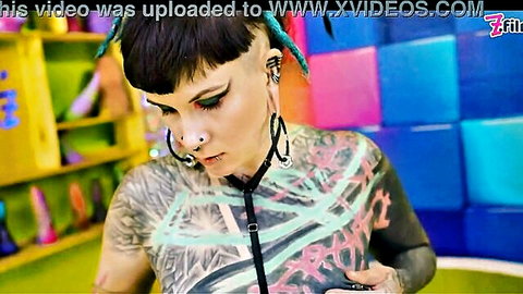 Tattooed alternative goth girl with piercings and harness in POV sex scene