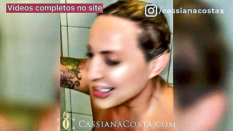 Tanned blonde Brazilian MILF Cassiana Costa smiling seductively in steamy shower