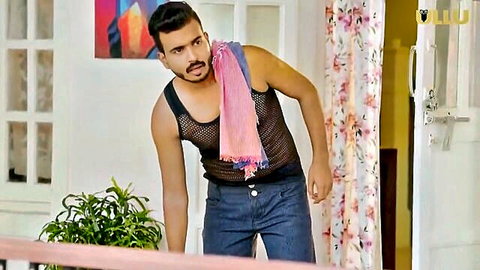 Muscular Indian man in mesh tank top and pink scarf, Ullu hot series teaser