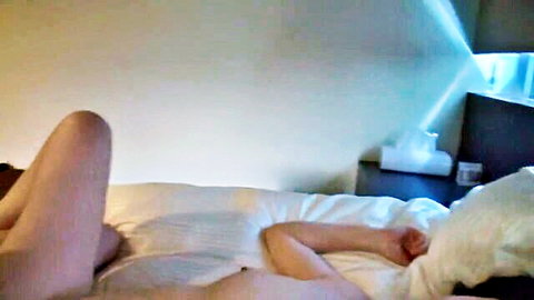 Mature Japanese milf in white panties spreading legs on bed, JAV tease