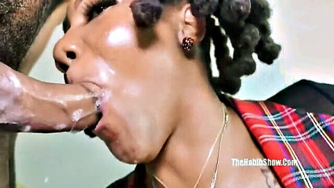 Ebony woman with dreadlocks has thick cum dripping from her open mouth gripped by black hand