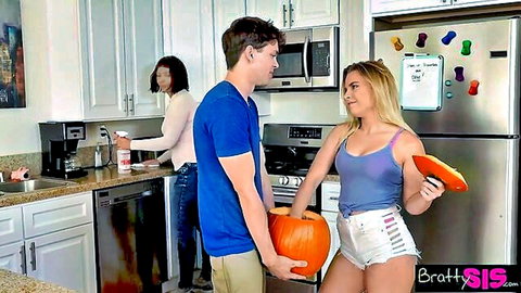 Blonde stepsister in tiny shorts holds pumpkin flirting with stepbro in kitchen