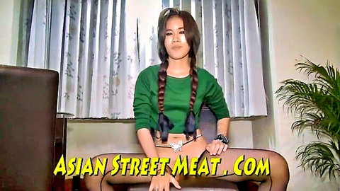 Cute Asian brunette with pigtails spreads legs wide in green top and black stockings teasing pussy