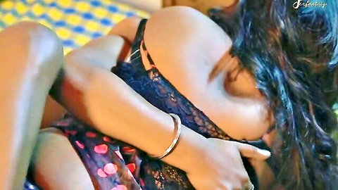Busty Indian housewife in black lace lingerie showing cleavage and curves