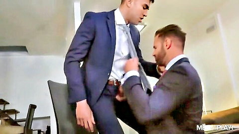 Alexander Muller grabs Dani Robles' bulge in suits over desk gay scene