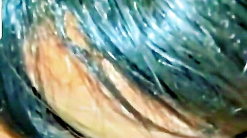 Blue-haired babe licks throbbing cock head with extended tongue and dripping saliva closeup
