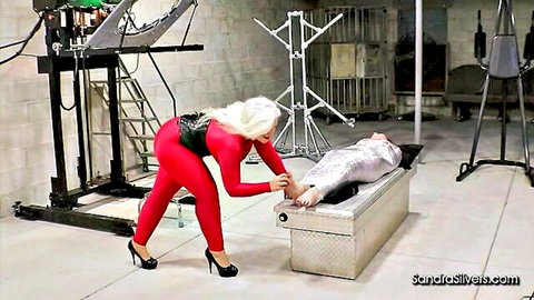 Blonde Sandra Caroline in latex tickles mummified sub BDSM