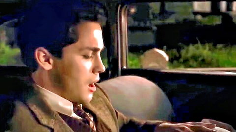 Vintage Hollywood actor in suggestive car oral scene from classic film