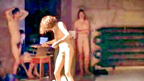 Nude dancers in explicit performance, group nudity and genitals visible (2010)